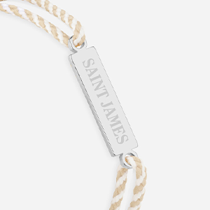 Logo Saint James rayé blanc et beige plaqué argent