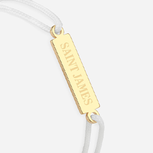 Logo Saint James blanc plaqué or